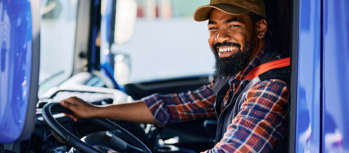 happy-black-driver-driving-his-truck-and-looking-a-2024-01-30-00-31-32-utc copy